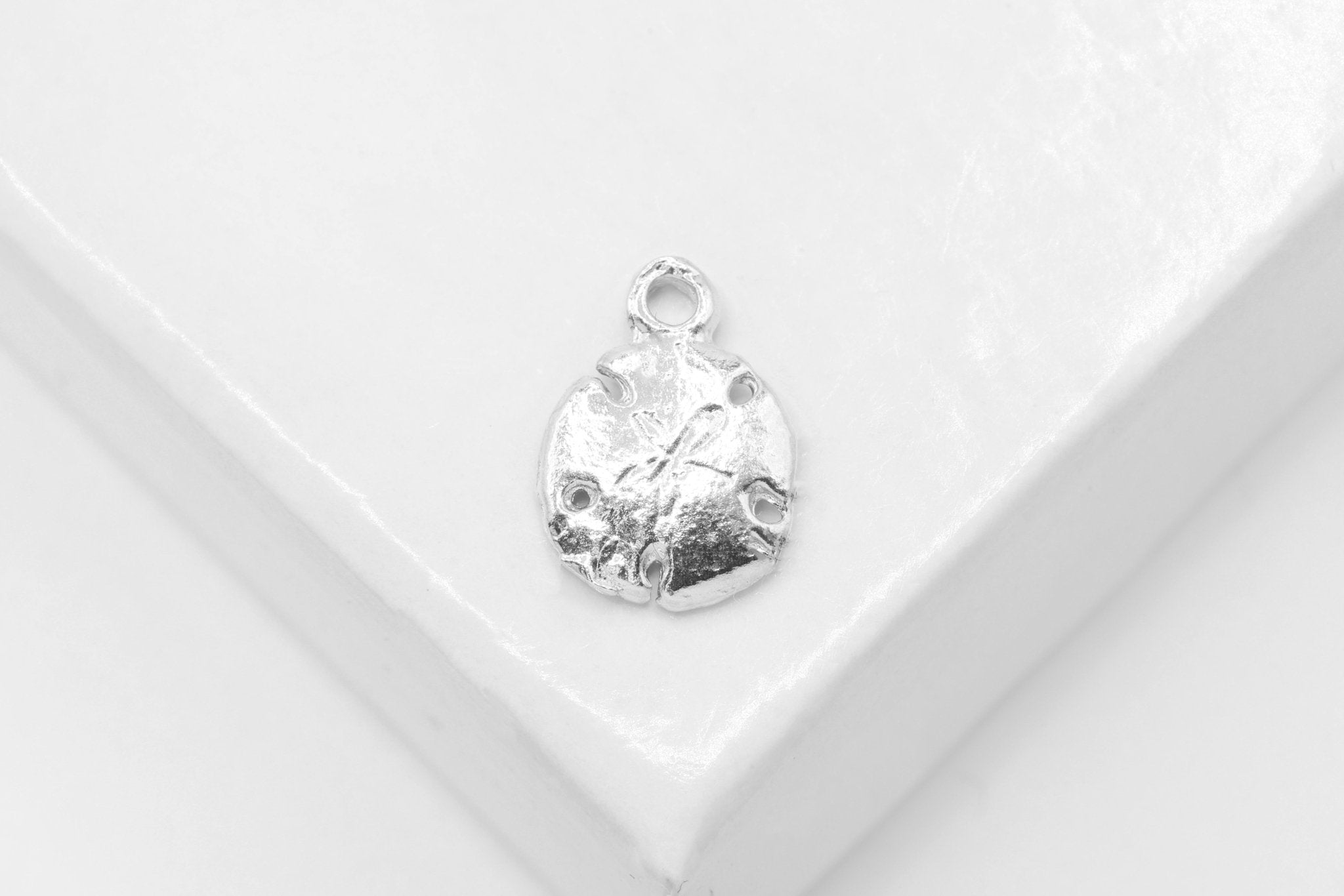 Sand Dollar Charm, Wholesale, 925 Sterling Silver, 10mm x 7mm - HarperCrown