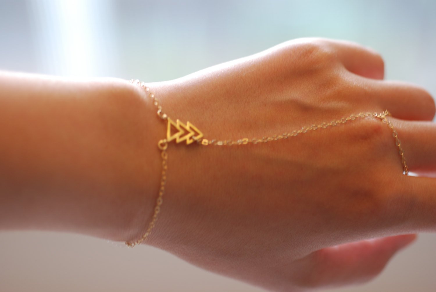 Finger chain bracelet gold sales